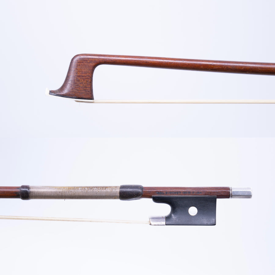 A Silver Mounted Violin Bow From Carl Fischer, New York.